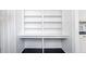 White built-in bookshelves and desk combination at 106 Church St # D, Charleston, SC 29401