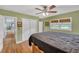 Light-filled bedroom with hardwood floors, ceiling fan and access to hallway at 148 Chadwick Dr, Charleston, SC 29407