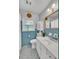 Updated bathroom with blue tile, white vanity, and modern fixtures at 148 Chadwick Dr, Charleston, SC 29407