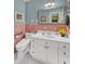 Clean bathroom with pink tile, white vanity, and modern toilet at 148 Chadwick Dr, Charleston, SC 29407