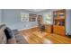 Home office with hardwood floors, built-in shelving, and a comfortable sofa at 148 Chadwick Dr, Charleston, SC 29407
