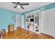 Bedroom with hardwood floors, ceiling fan and built-in shelving at 148 Chadwick Dr, Charleston, SC 29407
