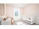 Bright Bedroom with crib, window, and charming decor at 509 Frutchey Ct, Summerville, SC 29486