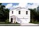 Two-story white house with a garage and front porch at 509 Frutchey Ct, Summerville, SC 29486