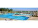 Resort-style pool with spacious deck, lounge chairs, and water features at 509 Frutchey Ct, Summerville, SC 29486