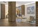 Lobby with brick columns, seating area, and access to exterior at 14 Lockwood Dr # 10D, Charleston, SC 29401