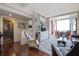 Bright living room with hardwood floors, leather furniture, and built-in shelving at 14 Lockwood Dr # 10D, Charleston, SC 29401