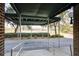 Covered entryway with view of pond and landscaping at 14 Lockwood Dr # 10D, Charleston, SC 29401