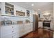 Well-equipped kitchen featuring white cabinets, granite countertops, and stainless steel appliances at 14 Lockwood Dr # 10D, Charleston, SC 29401