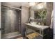 Spa-like bathroom with a glass-enclosed shower and marble vanity at 14 Lockwood Dr # 10D, Charleston, SC 29401