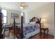 Charming bedroom with hardwood floors and a patchwork quilt at 14 Lockwood Dr # 10D, Charleston, SC 29401