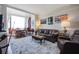 Spacious living area featuring hardwood floors, leather sofas, and water views at 14 Lockwood Dr # 10D, Charleston, SC 29401