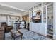 Spacious living room with hardwood floors, leather seating, and a built-in entertainment center at 14 Lockwood Dr # 10D, Charleston, SC 29401