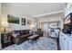 Elegant living room with leather furniture, a built-in entertainment center, and hardwood floors at 14 Lockwood Dr # 10D, Charleston, SC 29401