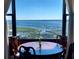 Dining room with bay window offering scenic water views at 14 Lockwood Dr # 10D, Charleston, SC 29401