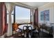 Charming dining area with a round table and chairs, offering stunning water views at 14 Lockwood Dr # 10D, Charleston, SC 29401