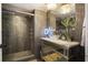 Spa-like bathroom with a glass-enclosed shower and marble vanity at 14 Lockwood Dr # 10D, Charleston, SC 29401