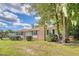 Brick ranch home with a tree-lined yard at 525 Parkdale Drive, Charleston, SC 29414