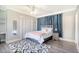 Bright bedroom with a queen bed and blue curtains at 525 Parkdale Drive, Charleston, SC 29414