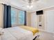 Spacious bedroom with a queen bed, ceiling fan, and large closet at 525 Parkdale Drive, Charleston, SC 29414