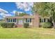 Charming ranch home with brick chimney and well-manicured lawn at 525 Parkdale Drive, Charleston, SC 29414