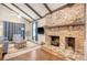 Cozy living room featuring a brick fireplace, hardwood floors, and vaulted ceilings at 525 Parkdale Drive, Charleston, SC 29414