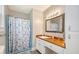 Bathroom with a shower and wood countertop vanity at 525 Parkdale Drive, Charleston, SC 29414