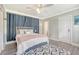 Bedroom with a queen bed, blue curtains, and hardwood floors at 525 Parkdale Drive, Charleston, SC 29414