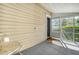Screened porch with a small table and chairs at 525 Parkdale Drive, Charleston, SC 29414