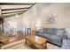 Open living area with hardwood floors, comfy seating and access to dining area at 525 Parkdale Drive, Charleston, SC 29414