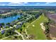 Aerial view of neighborhood near golf course and water at 1556 Oakhurst Dr, Mount Pleasant, SC 29466