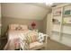 Bright bedroom with a full bed and built-in bookcases at 309 Wintergreen Rd, Walterboro, SC 29488