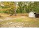 Backyard with shed, firepit and wooden fence at 309 Wintergreen Rd, Walterboro, SC 29488