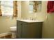 Updated bathroom with gray vanity, white sink, and window at 309 Wintergreen Rd, Walterboro, SC 29488