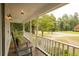Spacious front porch with rocking chairs and view of the street at 309 Wintergreen Rd, Walterboro, SC 29488
