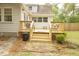 Back deck with stairs leading to backyard, offering additional outdoor space at 309 Wintergreen Rd, Walterboro, SC 29488