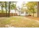 House backyard with wooden fence and gate at 309 Wintergreen Rd, Walterboro, SC 29488