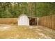 White shed with wooden doors in backyard at 309 Wintergreen Rd, Walterboro, SC 29488