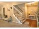 Entryway with a staircase, bench, and decorative wall art at 309 Wintergreen Rd, Walterboro, SC 29488