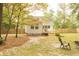 White house backyard with deck and trees at 309 Wintergreen Rd, Walterboro, SC 29488