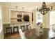 Charming dining room features a wood table, chandelier, and access to the kitchen at 309 Wintergreen Rd, Walterboro, SC 29488