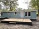 Newly renovated light blue house with large deck and mature trees at 861 Savage Rd, Charleston, SC 29414