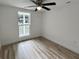 Spacious bedroom with hardwood floors and a window at 861 Savage Rd, Charleston, SC 29414