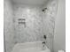 Clean bathroom with a bathtub and marble tile shower surround at 861 Savage Rd, Charleston, SC 29414