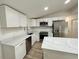 Modern kitchen with white cabinets, quartz countertops, and stainless steel appliances at 861 Savage Rd, Charleston, SC 29414