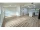 Open living room with hardwood floors and kitchen view at 861 Savage Rd, Charleston, SC 29414