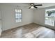 Bright bedroom featuring hardwood floors and large windows at 861 Savage Rd, Charleston, SC 29414