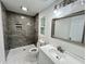 Updated bathroom with gray marble shower and modern vanity at 861 Savage Rd, Charleston, SC 29414