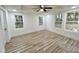 Bright bedroom with hardwood floors and multiple windows at 861 Savage Rd, Charleston, SC 29414