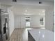 Open living room with hardwood floors and access to kitchen at 861 Savage Rd, Charleston, SC 29414